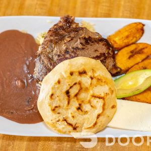 Bandeja Salvadoreña rice,carne asada, fried sweet plantain, refried beans,avocado,salvadoran cheese,pupusa revuelta