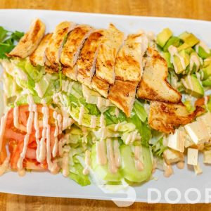 Ensalada Tazumal. chicken breast ala plancha, lettuce,tomato,cucumber,avocado,salvadoran cheese,mayo ketchup dressing
