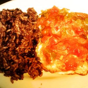 Huevos Rancheros. 2 fried eggs,ranchero sauce , rice a d beans