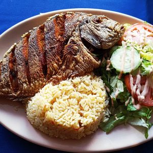 Pescado Frito whole fried porgy,rice and salad