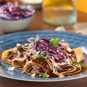 Enchilada de Res. 2 per order , slow cooked sirlion, lettuce,tomato, cucmber , grated cheese , mayo-ketchup